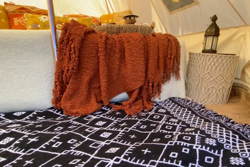 using blankets and pillows is a good DIY glamping idea